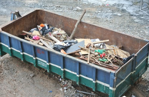 Business professionals discussing waste removal strategies in Earls Court.