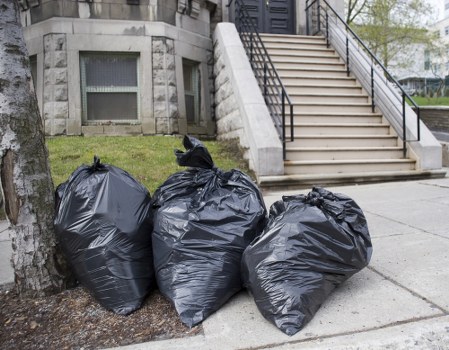 Recycling bins and waste segregation in an office environment.